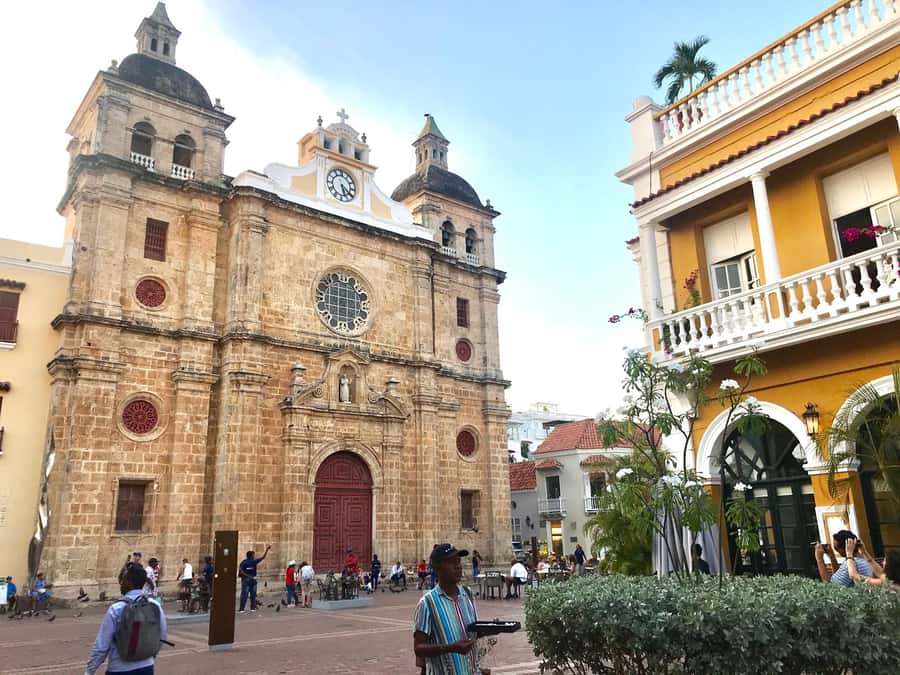 Cartagena City Tour with San Felipe Castle & Old Town Walk - Plaza de la Aduana and Cartagena’s difficult past