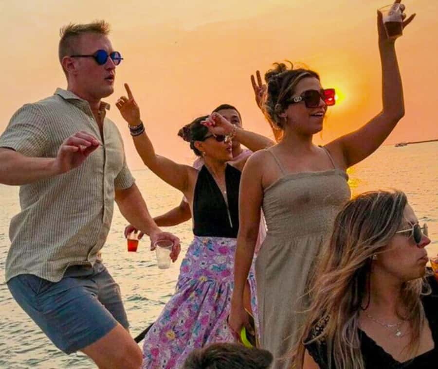 Cartagena de Indias: Sunset Cruise Open Bar with Dance Show - Dance lessons, performers, and a DJ on deck
