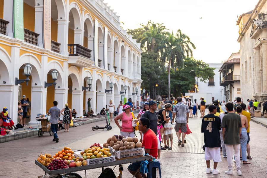 Cartagena: Guided Street Food Tour with Tastings - Starting beneath the orange umbrellas at Plaza Cervantes