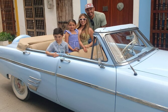 Cartagena Luxury Classic Car Tour + Bilingual Historian Guide - Plaza Santo Domingo and the city’s balconies