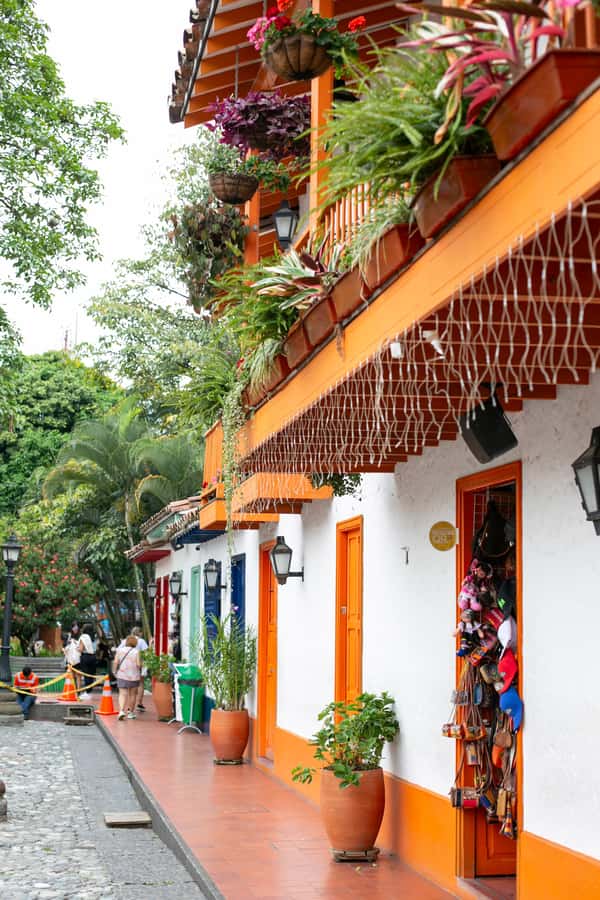 City Tour Medellin with a Chiva or a thematic van - Food, water, clothing, and pace