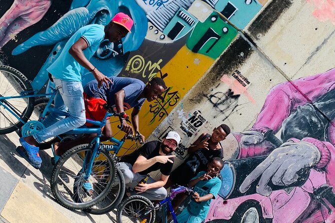 Commune 13, Graffitour street food. History.All inclusive - Graffiti, music, and the neighborhood’s story