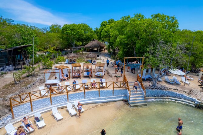 Discover Isla del Rosario Live The Enchanted Beach Experience - Meeting the boat at Muelle de la Bodeguita