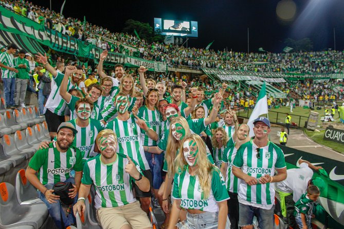 Medellín Football Tour - Drinks, face paint, and team colors before kickoff