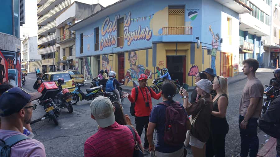 Shared Tour Cali's Salsa, Graffiti & Resistance Experience - Meeting under the red umbrellas at Jairo Varela