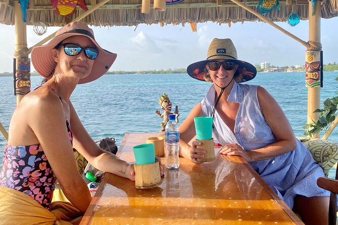 Sunset Tiki Bar Cruise in Caye Caulker, Belize - A small tiki boat with a big sunset view